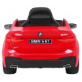 Bateriově napájené auto BMW 6 GT červené + dálkové ovládání + pomalý start + EVA + bezpečnostní pásy + MP3 LED