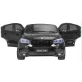 BMW X6M XXL pro 2 děti barva černá dálkové ovládání pásy pomalý start MP3 LED