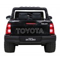 Dětská baterie Toyota Hilux černá + 4x4 + dálkové ovládání + 2 nosiče zavazadel + MP3 rádio + LED