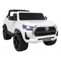 Bílá dětská baterie Toyota Hilux + 4x4 + dálkové ovládání + 2 nosiče zavazadel + MP3 rádio + LED