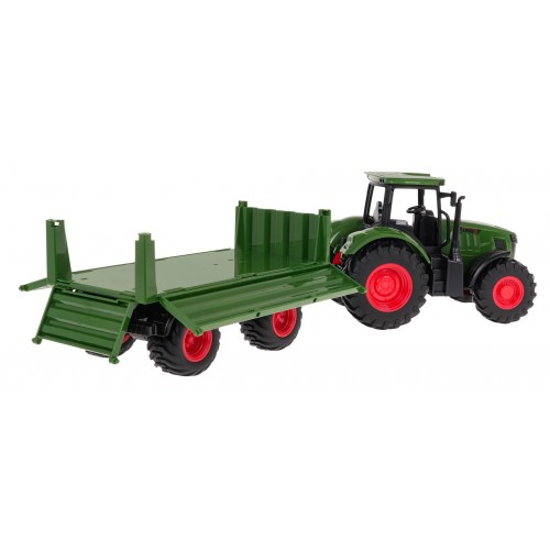 Zelený traktor s přívěsem