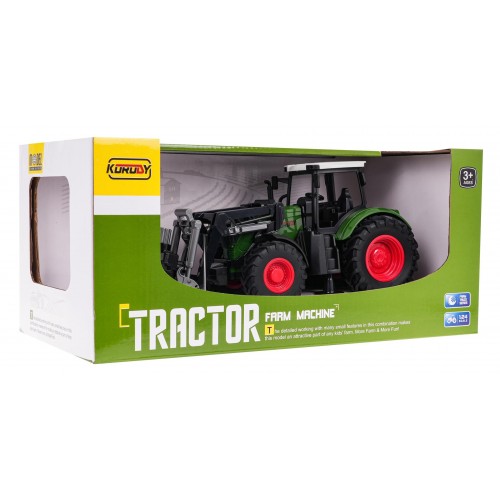 Zelený traktor s drapákem