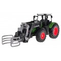 Zelený traktor s drapákem