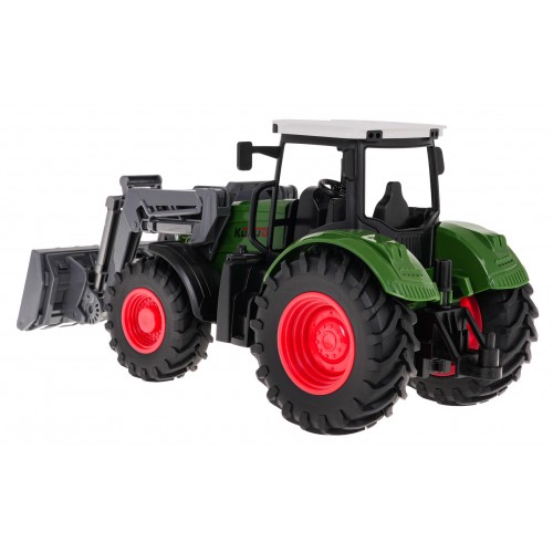 Zelený traktor s buldozerem