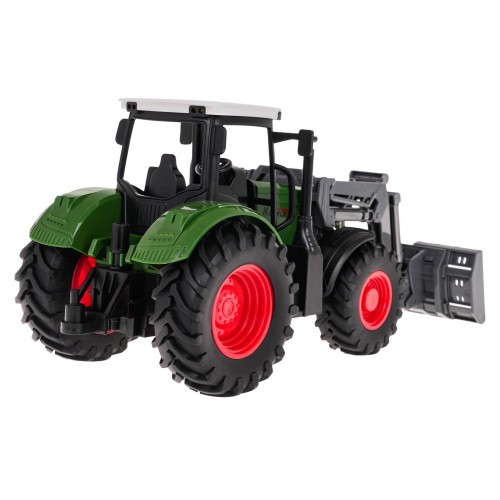 Zelený traktor s buldozerem