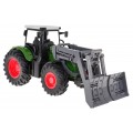 Zelený traktor s buldozerem