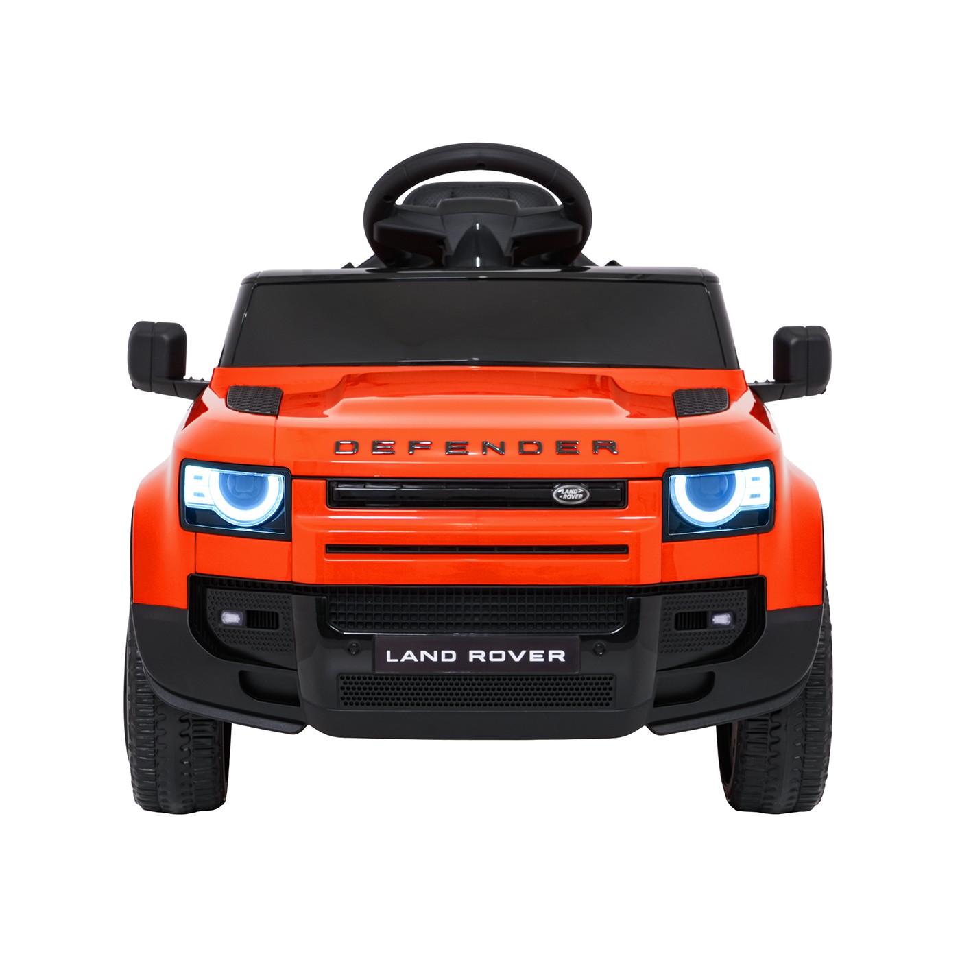 Oranžové vozidlo Land Rover Defender