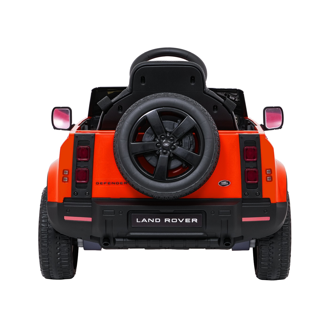 Oranžové vozidlo Land Rover Defender