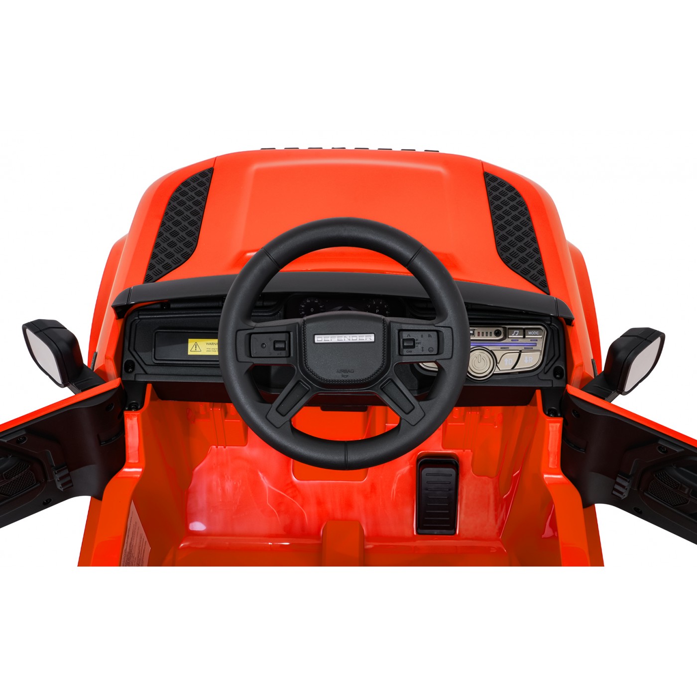 Oranžové vozidlo Land Rover Defender
