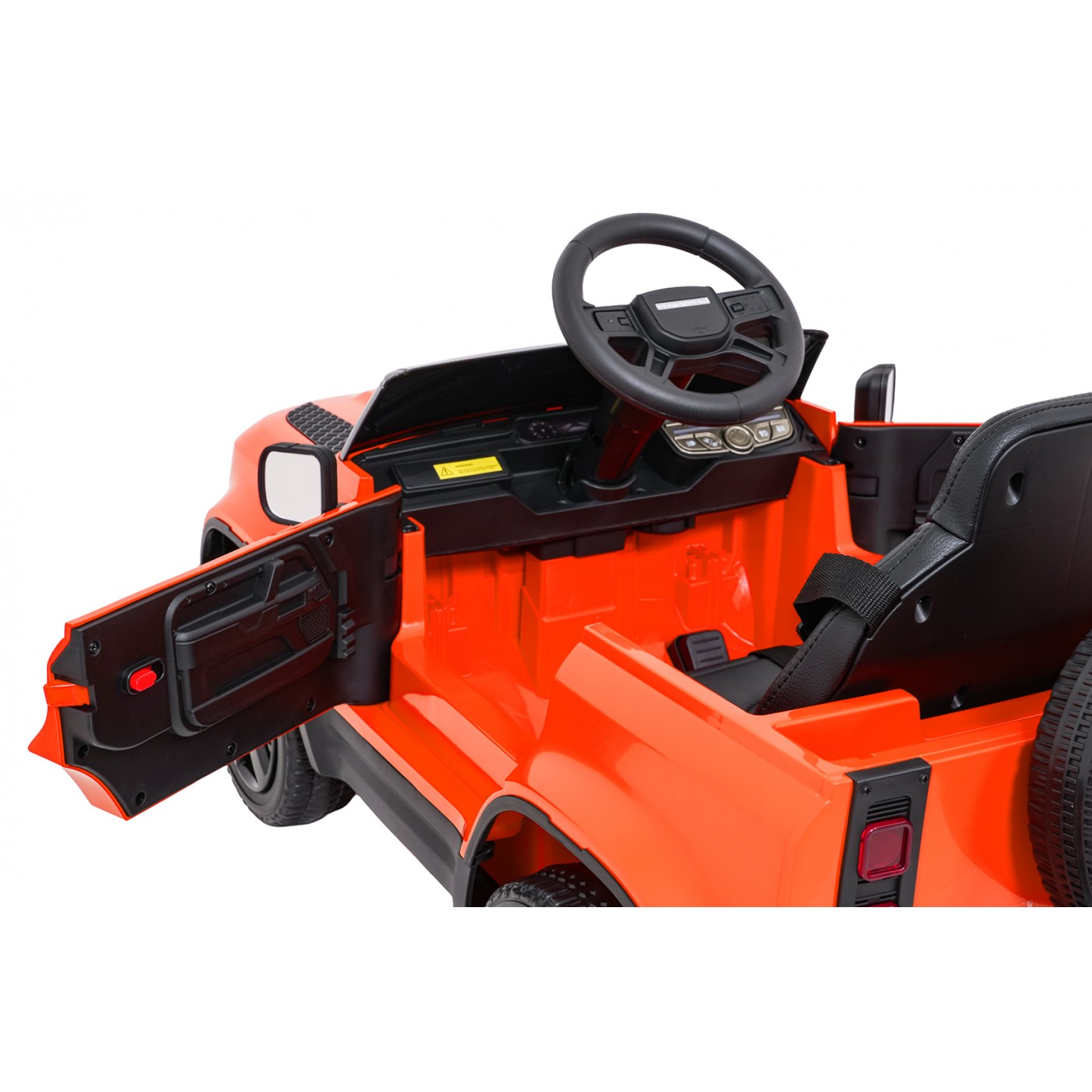 Oranžové vozidlo Land Rover Defender