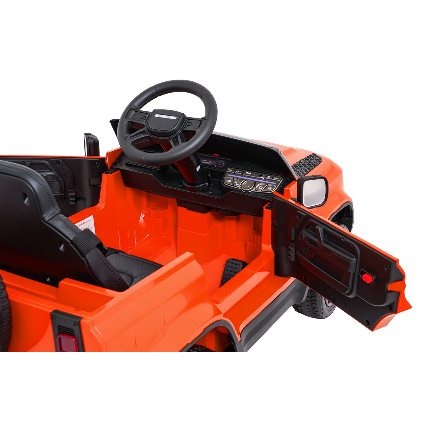 Oranžové vozidlo Land Rover Defender