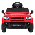Červené vozidlo Land Rover Defender