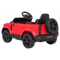 Červené vozidlo Land Rover Defender