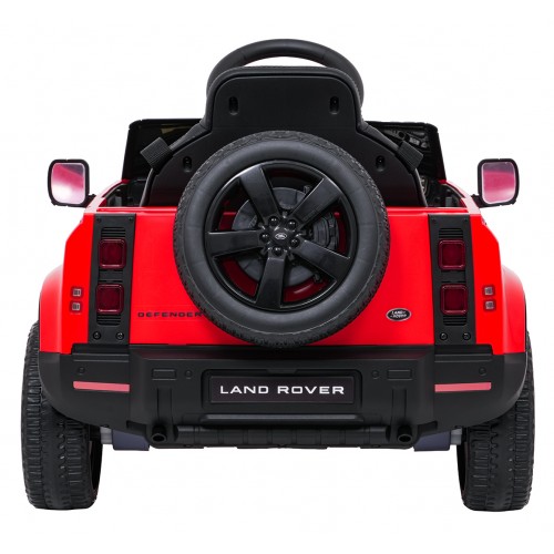 Červené vozidlo Land Rover Defender