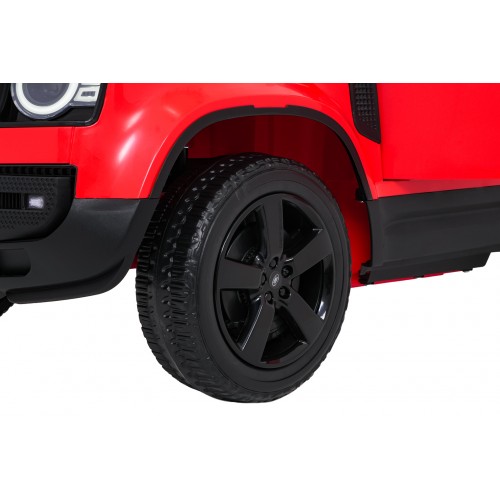 Červené vozidlo Land Rover Defender