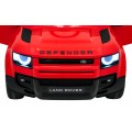 Červené vozidlo Land Rover Defender