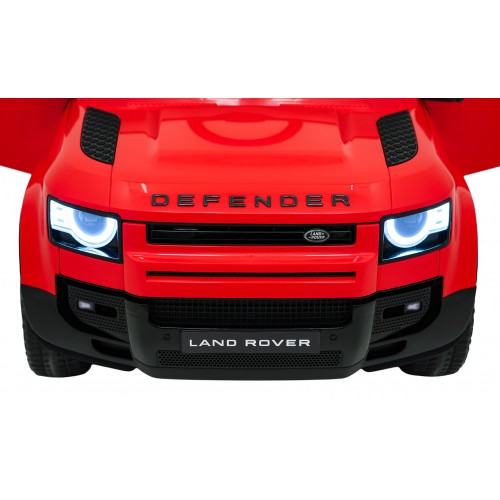 Červené vozidlo Land Rover Defender