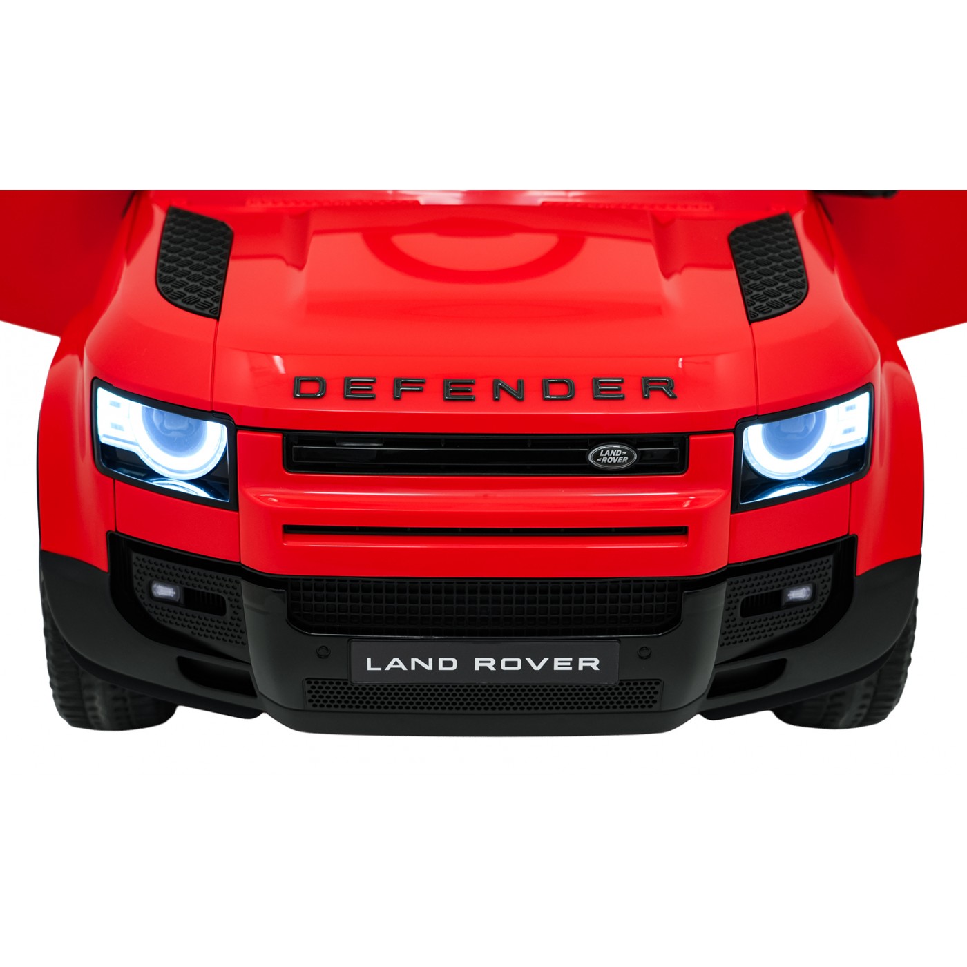 Červené vozidlo Land Rover Defender