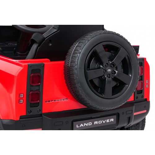 Červené vozidlo Land Rover Defender